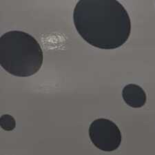 Carreau décoratif blanc à pois noirs